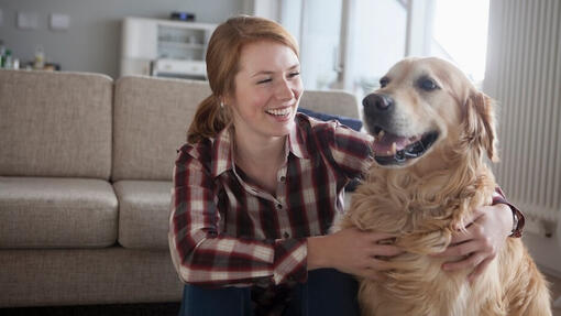 Woman hugging a dog